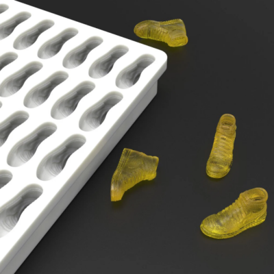 Custom silicone mold for Paradice chocolate tokens by Mold Press Qatar shoe choclate token Custom silicone mold for Paradice chocolate tokens by Mold Press Qatar shoe choclate token
